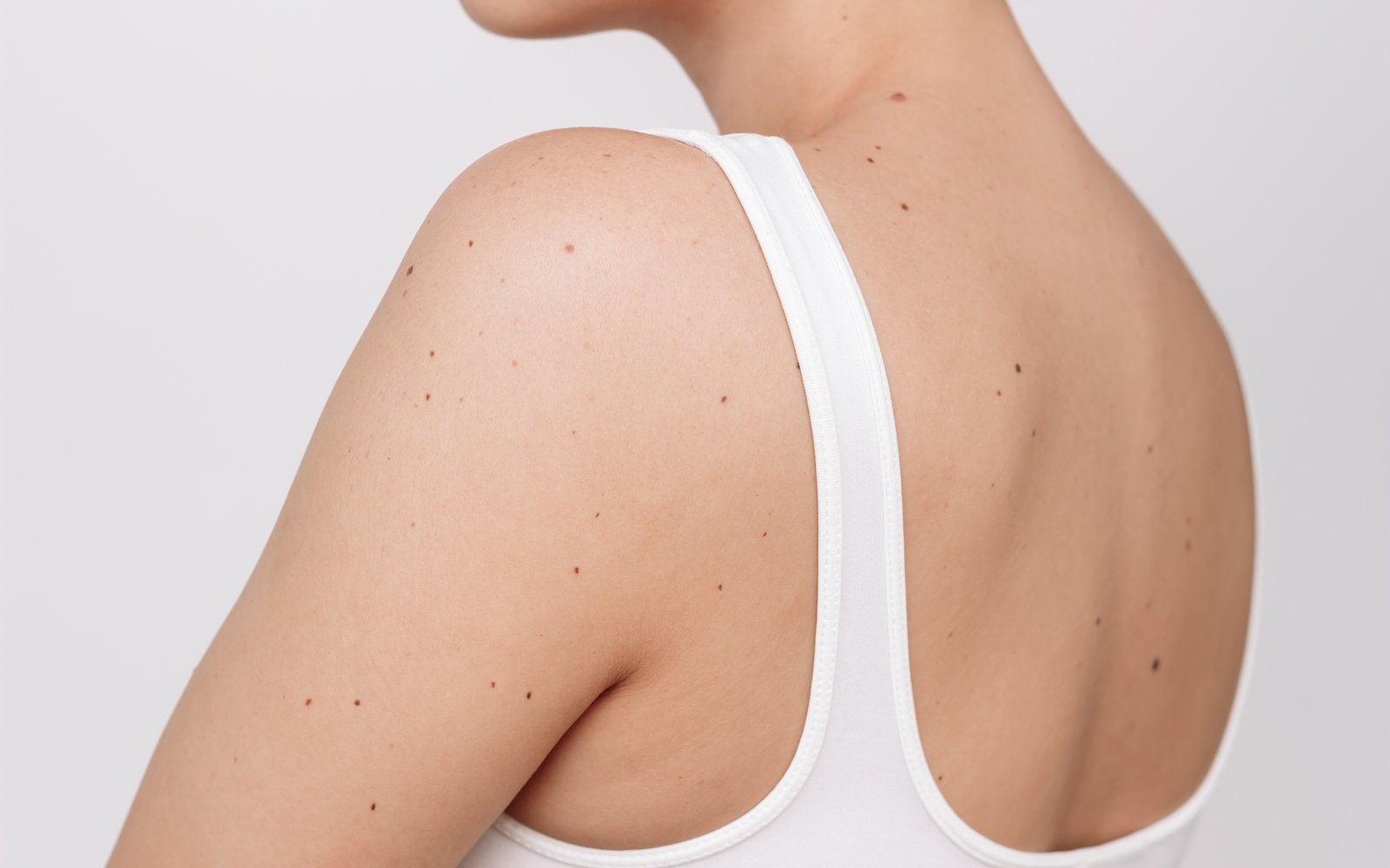 Soft natural light on shoulder skin texture